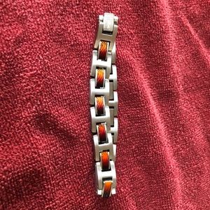 Men’s stainless steel and wood inlay bracelet.
